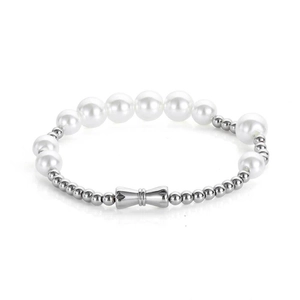 Elegant white pearl bracelet with a polished silver bow pendant on a clean white backdrop