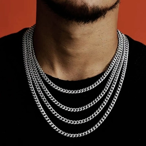 Polished silver stainless steel Cuban link chains in layered hip-hop style for men