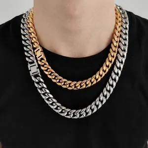 Three-layer men's Cuban link chain set in gold and silver finish on black t-shirt
