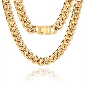 Polished gold Cuban link chain for men with secure clasp on a white reflective background