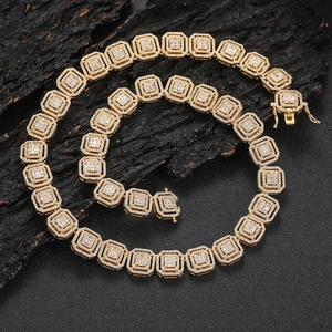 Macro shot of 13mm iced out hip hop square link chain with cubic zirconia in gold