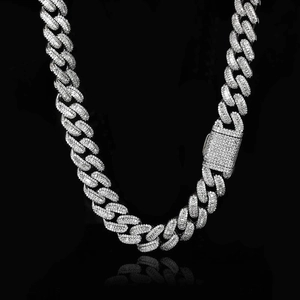 Detailed view of silver 15mm Cuban link necklace with iced out baguette zircon stones