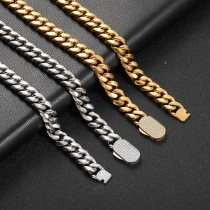 Hip hop cuban link chains in gold and silver with zircon paved box clasp on black leather