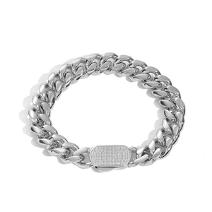 Detailed close-up of Cuban link bracelet with iced-out zirconia clasp on white background