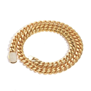 Chunky gold Cuban link chain necklace with a luxury iced-out zircon encrusted box clasp