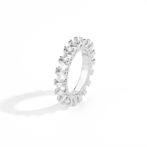 Detailed side view of 4mm single row zircon ring with classic claw setting in silver