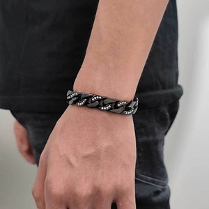 Macro shot of 12mm black Cuban link bracelet with white cubic zirconia side stones