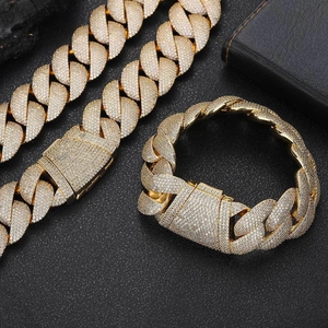 Macro shot of 24mm gold bubble Cuban chain set with iced out pave zircon crystals