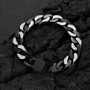 Macro view of 12mm Cuban link bracelet with matte black rings and inlaid zircons