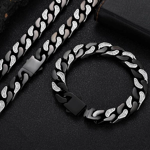 Detail of 12mm black and silver Cuban chain set with inlaid zircons on leather background