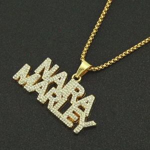 Hip hop style gold Makayla name necklace with iced out rhinestones on black texture