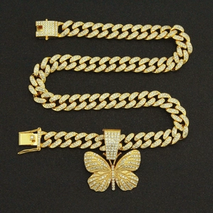 Hip hop gold Cuban link chain with a iced out butterfly pendant and sparkling crystals