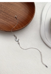 Detail of S925 silver moon bracelet with shimmering mother of pearl and lobster clasp