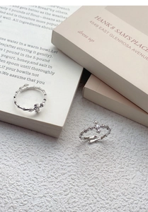 Close-up of S925 silver star cross ring with zircon and textured thorn band detail