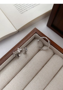 Detailed macro view of S925 silver rings with white agate and vintage floral engravings