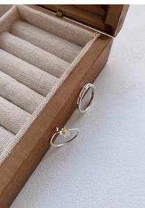 Detail of S999 silver rings featuring jasmine flower and twisted rope patterns