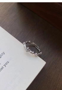 Detail of S925 sterling silver cross ring with leaf relief and zircon insets