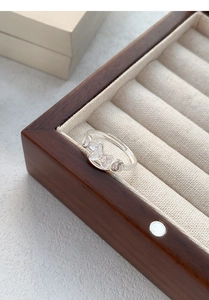 Detailed macro view of S999 silver ring featuring auspicious clouds and coin patterns