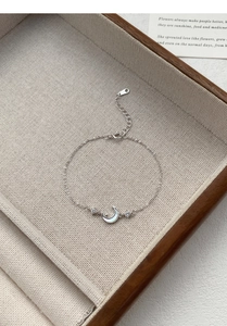 Detail of S999 silver moon bracelet with white mother of pearl and zircon stones