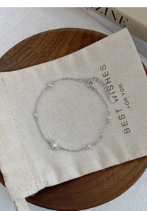 Detail of S999 silver bracelet with sparkling cubic zirconia and adjustable chain link