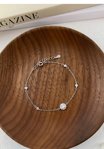 Detail of S925 sterling silver chain with zircon accents and S925 engraved tag
