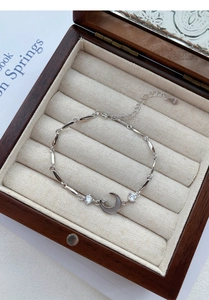 Macro view of S925 sterling silver crescent moon bracelet with S925 hallmark detail