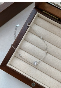 Macro detail of S999 silver bracelet featuring halo setting and micro-pave cubic zirconia