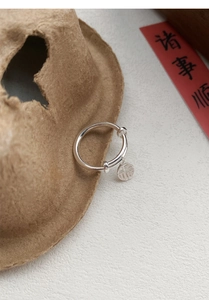 Detail of S925 silver ring featuring a round pendant with traditional Fu character