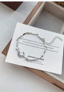 Detailed view of S925 sterling silver moon and star bracelet with lobster clasp and zircons