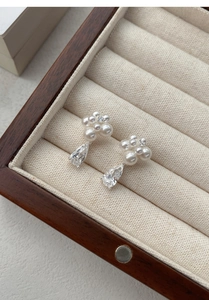Detailed view of S999 silver cluster pearl earrings with a pear-shaped zircon pendant