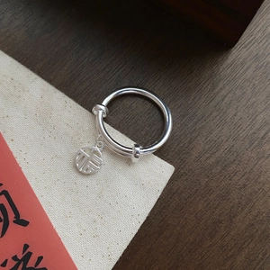 S925 sterling silver open ring featuring a hollowed round Fu character charm pendant
