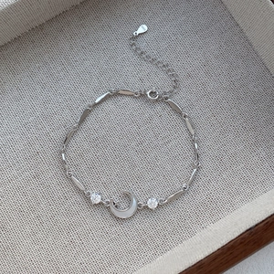 Exquisite S999 sterling silver moon bracelet with sparkling zircons and a shell accent