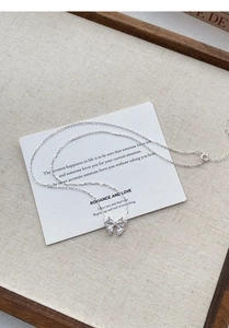 Detail of S999 silver butterfly pendant necklace featuring sparkling zircon pave setting
