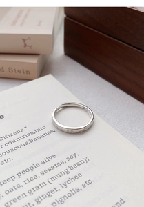 Close-up of S999 sterling silver couple ring with vintage sun pattern and adjustable open band