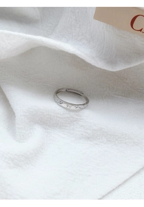 Detail of S999 silver ring with engraved butterfly pattern and lucky text engraving