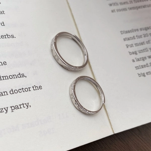 Romantic S999 sterling silver couple rings with butterfly relief on open book background