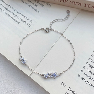 Elegant S925 sterling silver bracelet with light blue enamel flowers and sparkling zircons