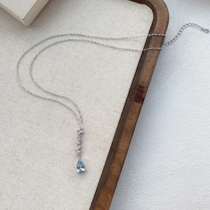 S925 sterling silver necklace featuring a blue teardrop zircon and white crystal pendant