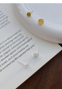 Artistic S999 silver rose and portrait relief stud earrings in French elegant style