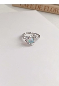 Detailed macro view of S925 hallmark on silver irregular lava ring with opal stone