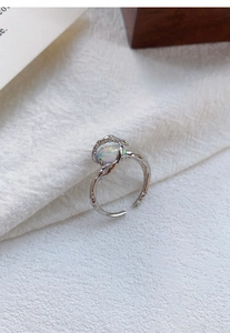 Macro detail of S925 silver lava ring with iridescent opal stone and adjustable band