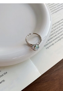 Detailed macro view of S925 sterling silver lava texture ring with opal stone