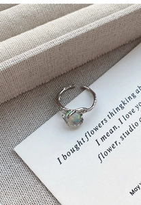 Macro detail of S925 silver lava opal ring with vine texture and micro-inlaid stones