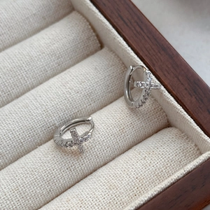 Polished S999 sterling silver hoop earrings featuring sparkling cross charms with white gems