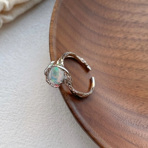 Adjustable S925 silver ring featuring an organic lava texture and rainbow opal gemstone