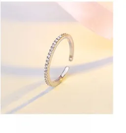 Close-up of S925 sterling silver sprout leaf ring with pavé set white zircon stones
