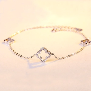 Macro shot of silver hollow clover bracelet with pavé cubic zirconia and O-chain details