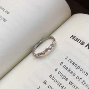 Elegant S999 silver wheat leaf open ring with sparkling cubic zirconia on book pages