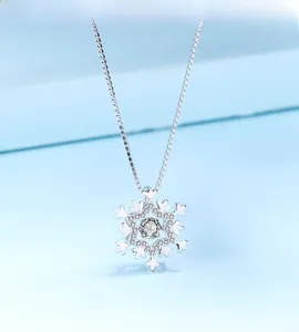 Macro shot of S925 sterling silver snowflake pendant with brilliant cubic zirconia stones