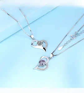 Detailed view of S925 silver heart necklaces with white and purple zircon stones